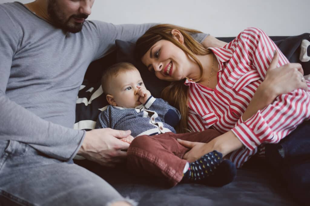 Parents Cuddling Their Baby Boy Son