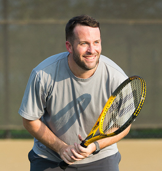 man with tennis racket