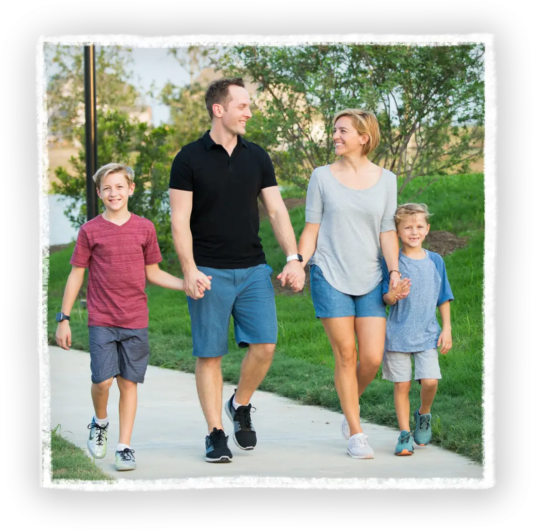 Family of four walking in Jordan Ranch
